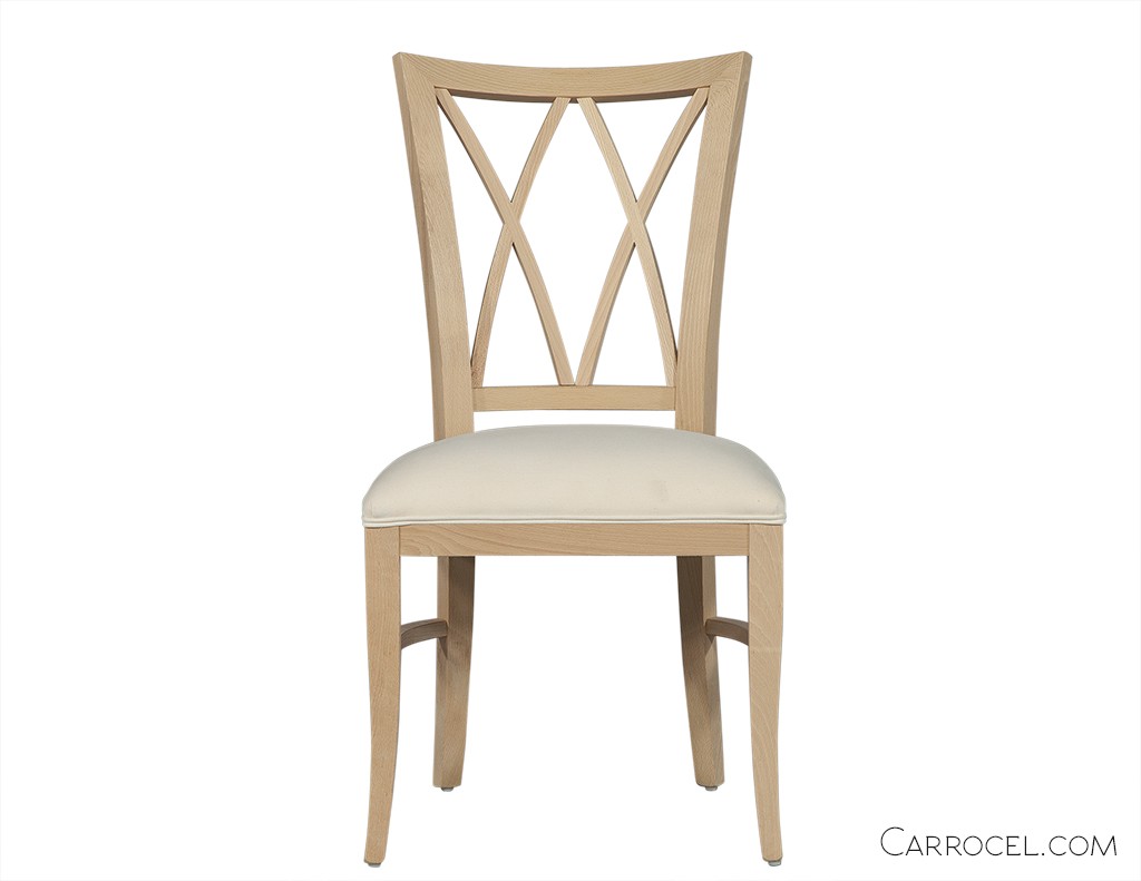 White dining room chair with a X patterns