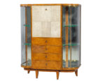 An elegant art deco style armoire with glass shelving and walnut veneer. Available for sale in Toronto.