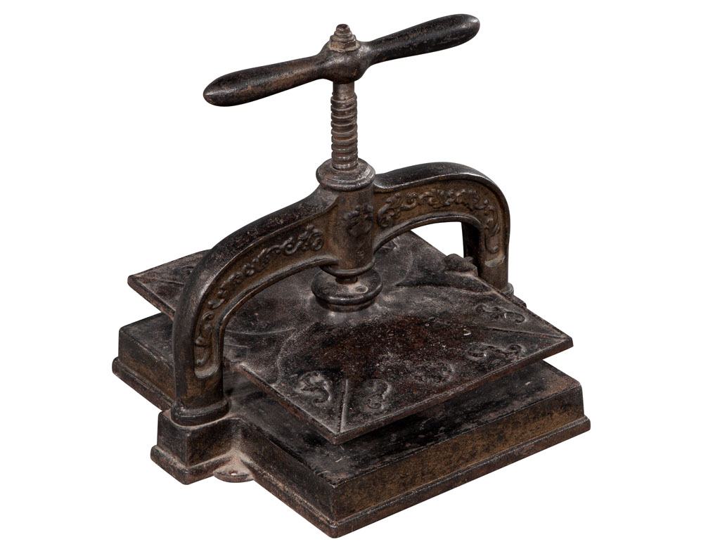 Lot - A cast iron book press, 19th century