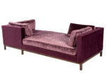 A contemporary plum velvet sofa with open-arm design, plush cushioning, and a streamlined wood base.