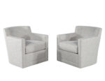 Comfortable set of grey fabric swivel accent chairs, perfect for adding style and comfort to your living space.