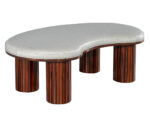 Kidney-shaped stool with dark wood legs and light upholstery, adding a sophisticated touch to any accent seating collection.